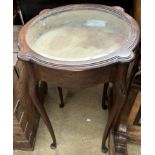 A mahogany bijouterie table of circular form on cabriole legs and pad feet