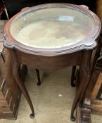 A mahogany bijouterie table of circular form on cabriole legs and pad feet