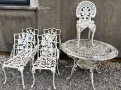 A white painted garden table and five chairs