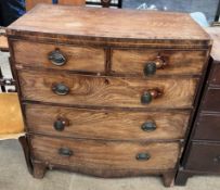 A 19th century mahogany chest of bowed form with two short and three long graduated drawers on