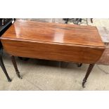 A Victorian mahogany Pembroke table with drop flaps on reeded legs