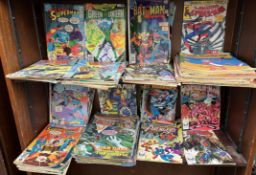 A collection of DC comics including Superman, Green Lantern, Batman, Spiderman, Eagle,