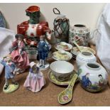 A pair of Staffordshire cow and calf spill vases together with a Royal Doulton figure 'Top o the