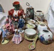 A pair of Staffordshire cow and calf spill vases together with a Royal Doulton figure 'Top o the