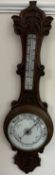 An oak cased aneroid barometer,