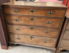 An 18th century oak chest with a rectangular top above four long graduated drawers on bracket feet,