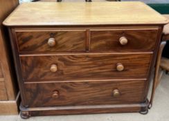 A Victorian mahogany chest with a rectangular top above two short and two long drawers on flattened