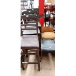 A set of three bar stools together with a walnut low chair and a stool