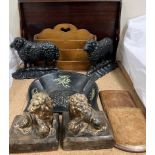 A pair of cast iron sheep doorstops together with a pair of lion book ends, tray,