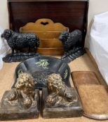 A pair of cast iron sheep doorstops together with a pair of lion book ends, tray,