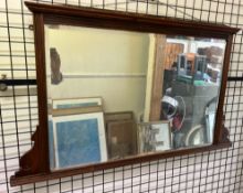 An Edwardian walnut framed overmantel mirror
