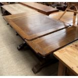 A 20th century oak draw leaf table together with a refectory type table