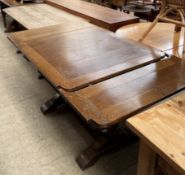 A 20th century oak draw leaf table together with a refectory type table