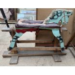 A 20th century small rocking horse on a fixed rocker base,