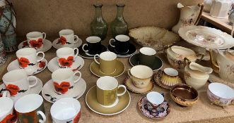 A Susie Cooper corn poppy part coffee set together with a Wedgwood part coffee set,