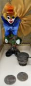 A Murano glass clown together with a silver mustard pot and two Elizabeth II five pounds coins