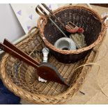 A wicker child's cot together with a wicker log basket, bellow,
