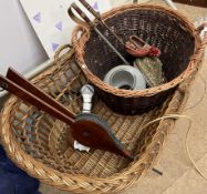 A wicker child's cot together with a wicker log basket, bellow,