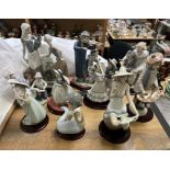 A Collection of Nao porcelain figures including a clown, an artist, dancing figures, musicians,