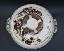 Attributed to Michael Cardew, a tureen and cover with scrolling decoration and twin handles,