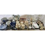 A collection of pottery storage jars together with decorative figures, vases,