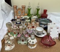 Assorted Staffordshire cottage pastille burners together with cranberry glass,