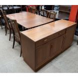 A 20th century teak dining suite comprising a sideboard,