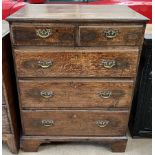 An 18th century oak chest with a rectangular top above two short and three long graduated drawers