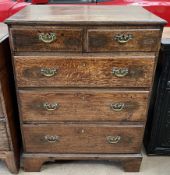 An 18th century oak chest with a rectangular top above two short and three long graduated drawers