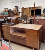 A teak sideboard with a fablon top together with a Singer sewing machine and a standard lamp
