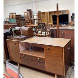 A teak sideboard with a fablon top together with a Singer sewing machine and a standard lamp