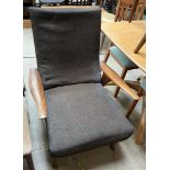 A mid 20th century teak upholstered elbow chair CONDITION REPORT: All furniture
