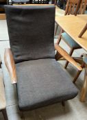 A mid 20th century teak upholstered elbow chair CONDITION REPORT: All furniture