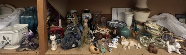 Dragon figures together with assorted vases, cat models,