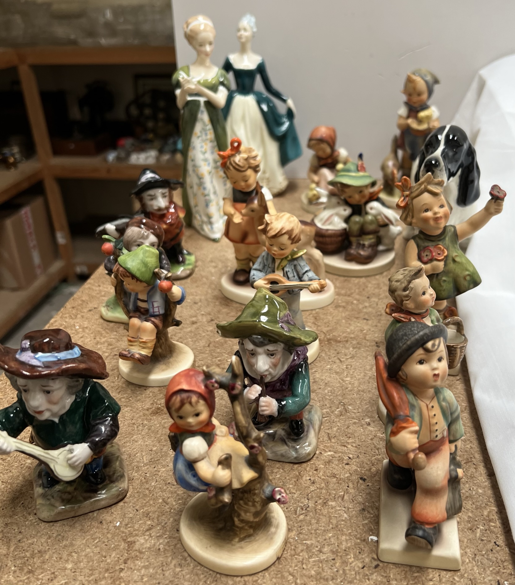 A collection of Hummel figures together with two Royal Doulton figures,