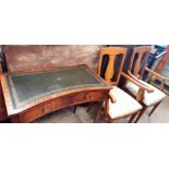 A reproduction mahogany desk together with a pair of elbow chairs