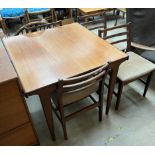 A mid 20th century G-Plan teak extending dining table and four chairs