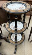 A late Victorian three tier cake stand inset with pottery dishes on shaped legs