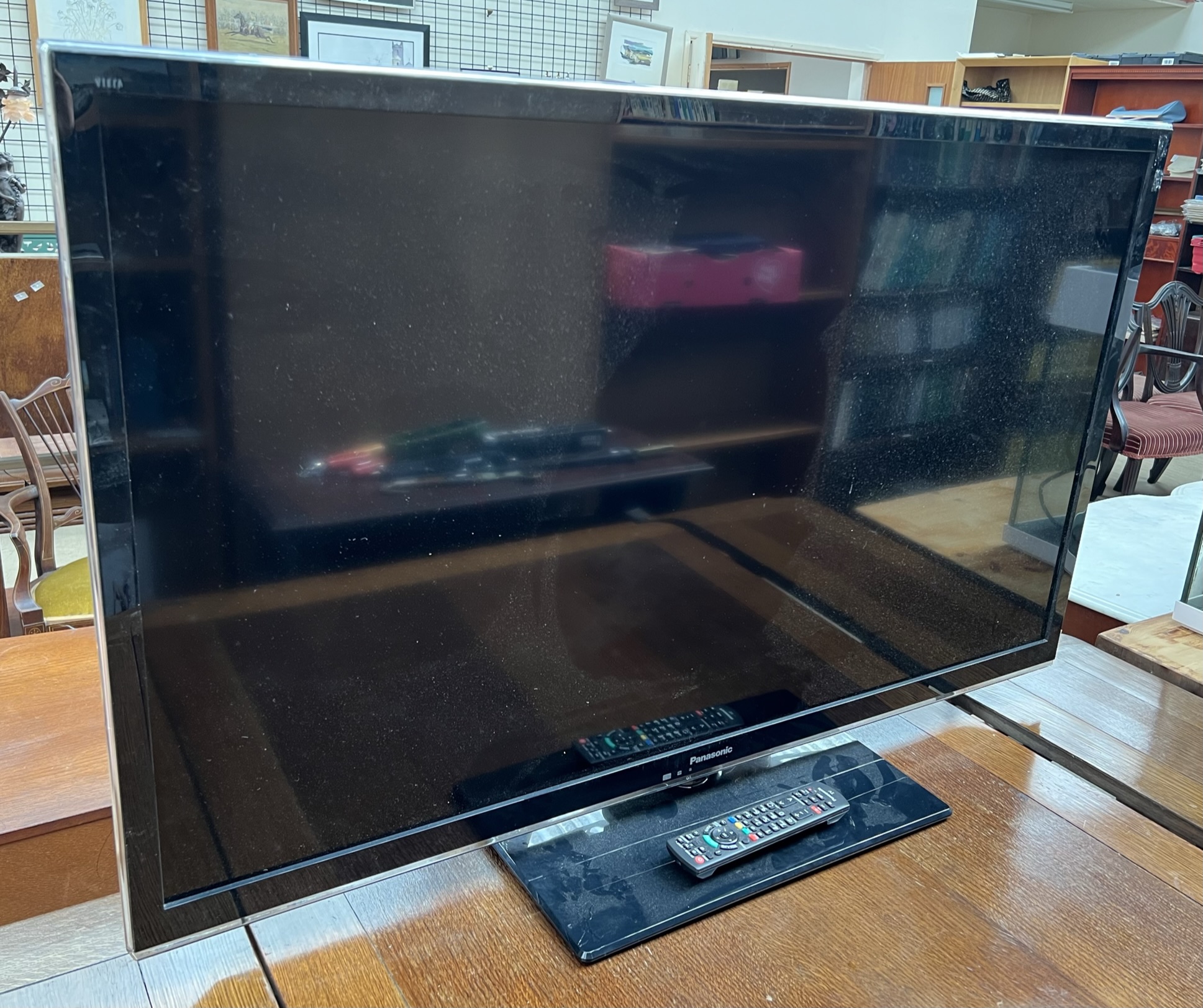 A Panasonic 50" television Model Number TX-L50EM5B and remote control CONDITION REPORT: