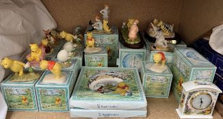 A large collection of Royal Doulton Winnie The Pooh figures,