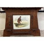 An early 20th century oak framed watercolour of a golfer