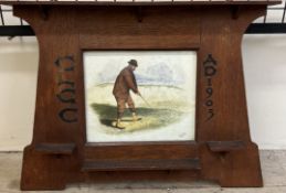 An early 20th century oak framed watercolour of a golfer