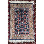 A rug with a blue ground and multiple guard stripes 175 x 101cm