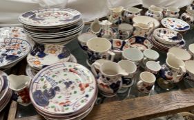 An extensive collection of Gaudy Welsh pottery including jugs, cups and saucers,