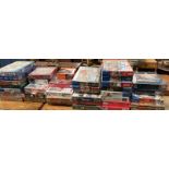 A large collection of new and opened Jigsaw puzzles