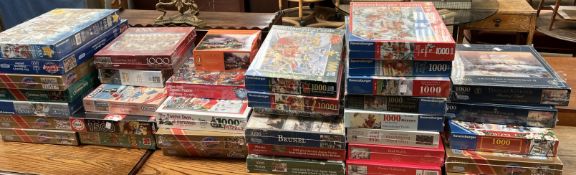 A large collection of new and opened Jigsaw puzzles