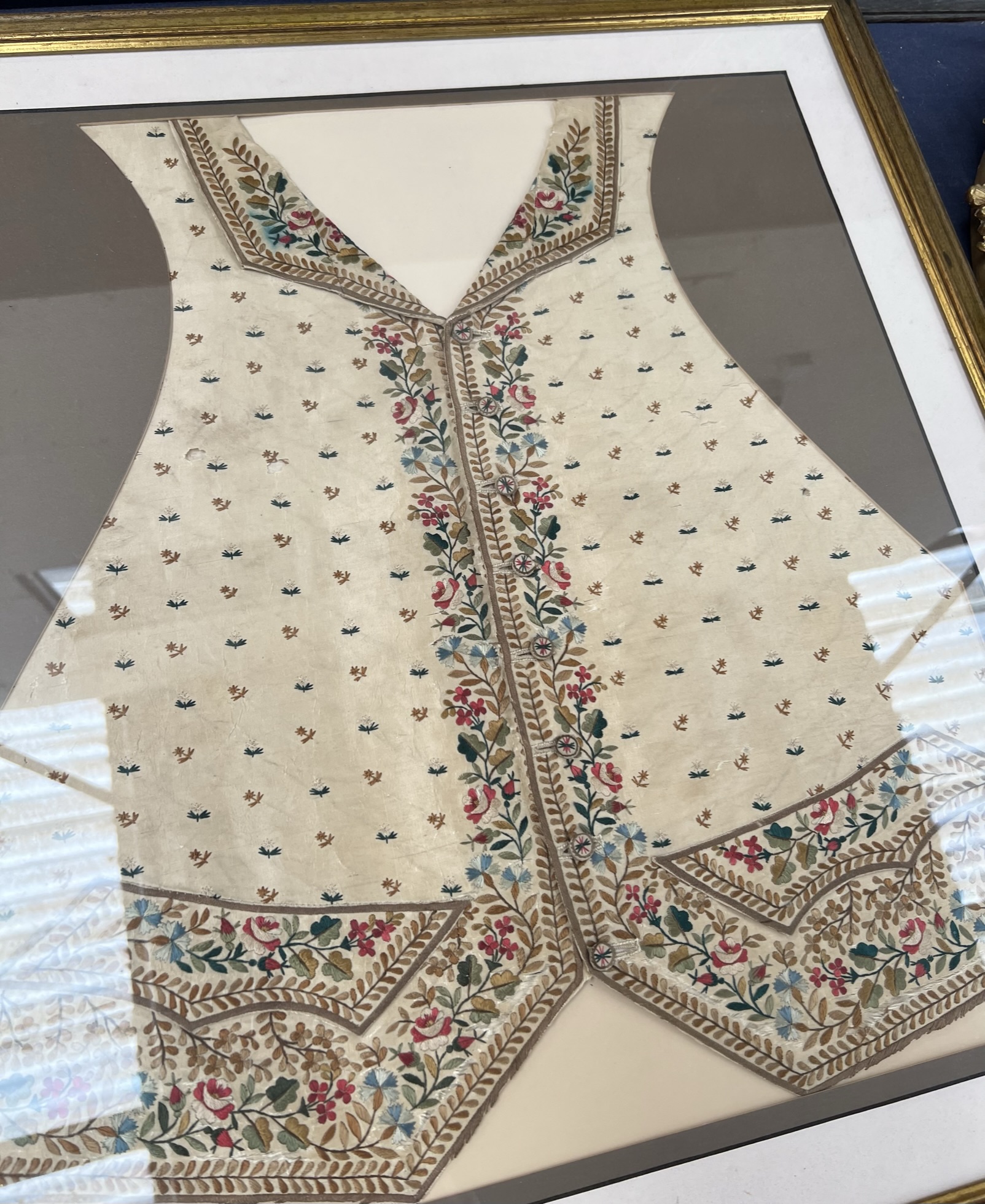 A silk waistcoat embroidered with roses and other flowers (framed) together with a sampler - Image 4 of 7