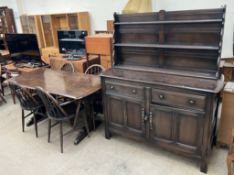 An Ercol sideboard together with a refectory type table,