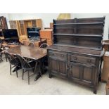 An Ercol sideboard together with a refectory type table,