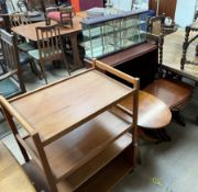 A teak tea trolley together with a teak low table, yew occasional table, bookcase,